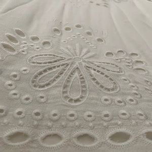 White embroidered sleeveless blouse